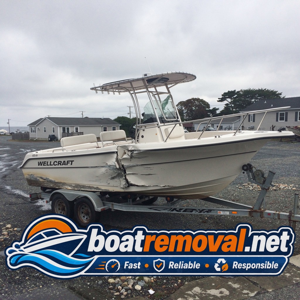 storm damaged boat removal Narragansett RI, 24 ft Wellcraft center console wrecked on trailer