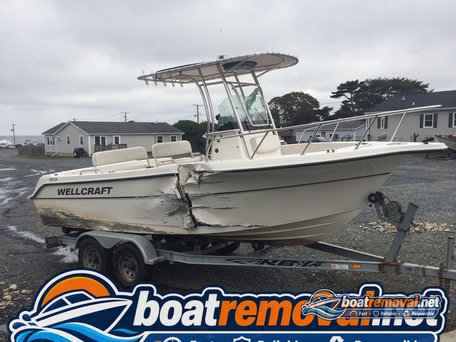 storm damaged boat removal Narragansett RI, 24 ft Wellcraft center console wrecked on trailer