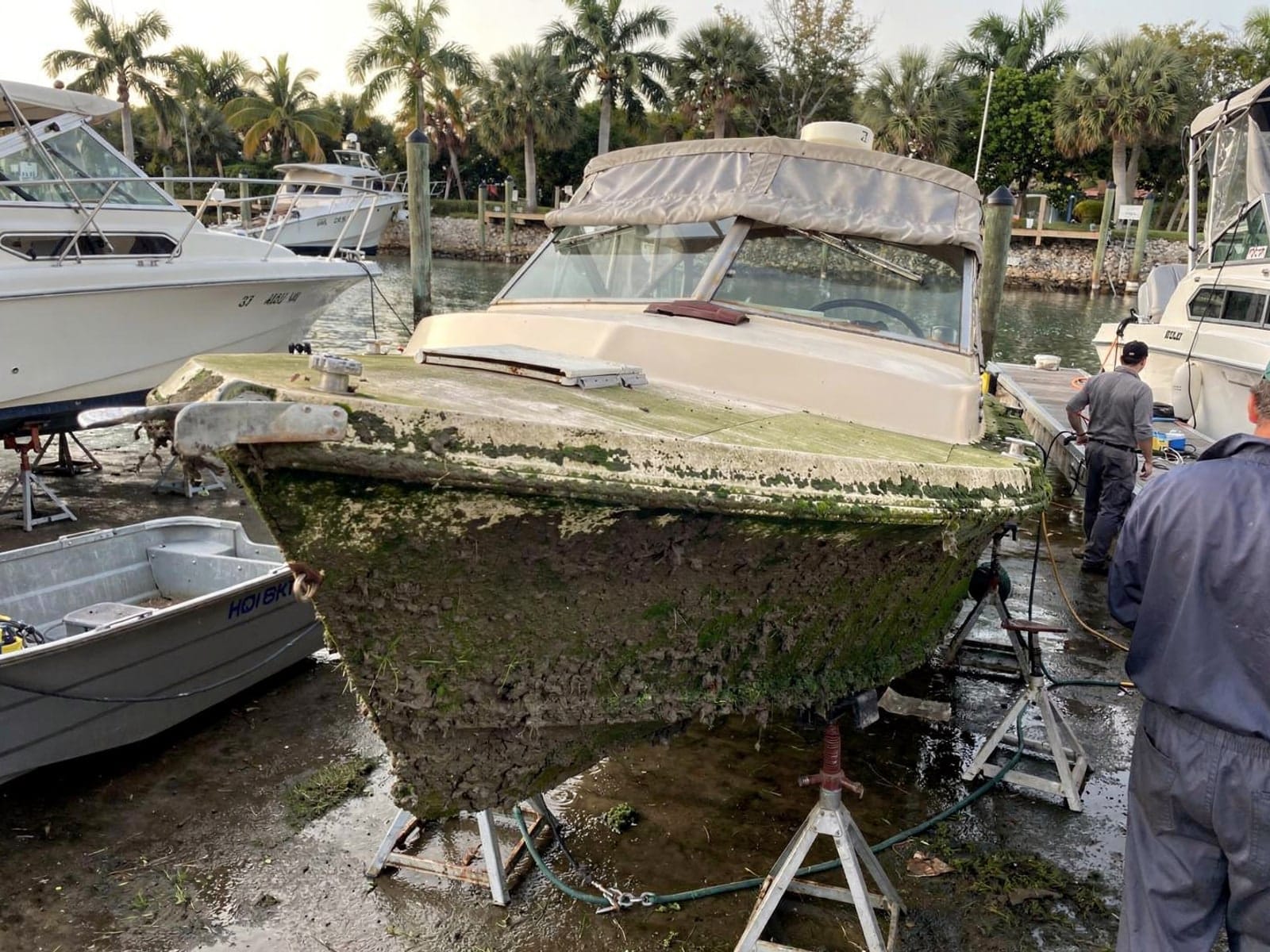 Sunken boat recovery in Panama City, FL: at the repair yard 23 ft Chris-Craft Cavalier from Panama City, FL on stands at a repair yard after the recovery