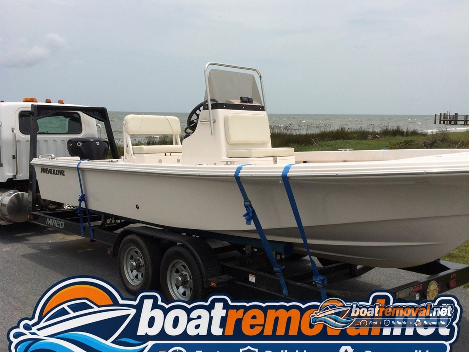 Berlin, MD: 21-foot Mako center console loaded for removal Mako center console loaded onto a trailer after being pulled from a canal near Berlin, Maryland