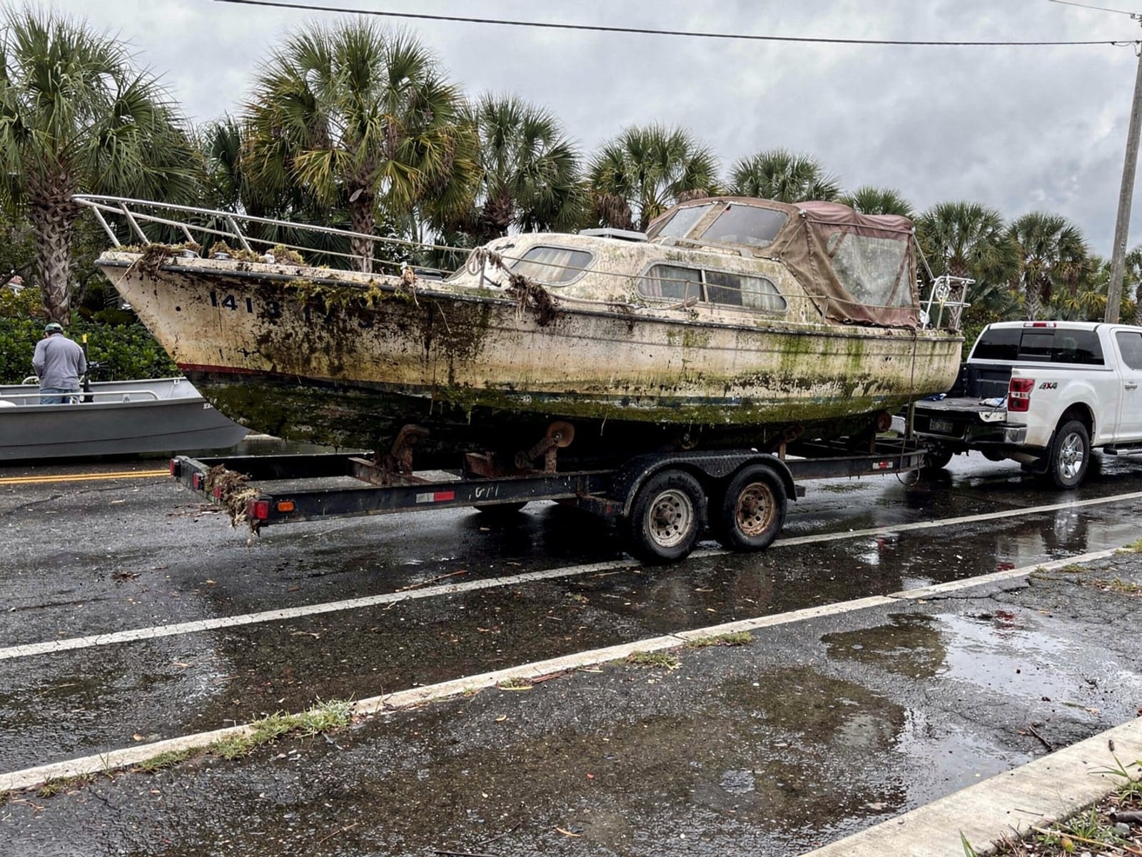 Sunken boat recovery in Bonita Springs, FL: hauled out on a trailer 26 ft Pearson 26 hauled out of Bonita Springs, FL on a trailer after the recovery