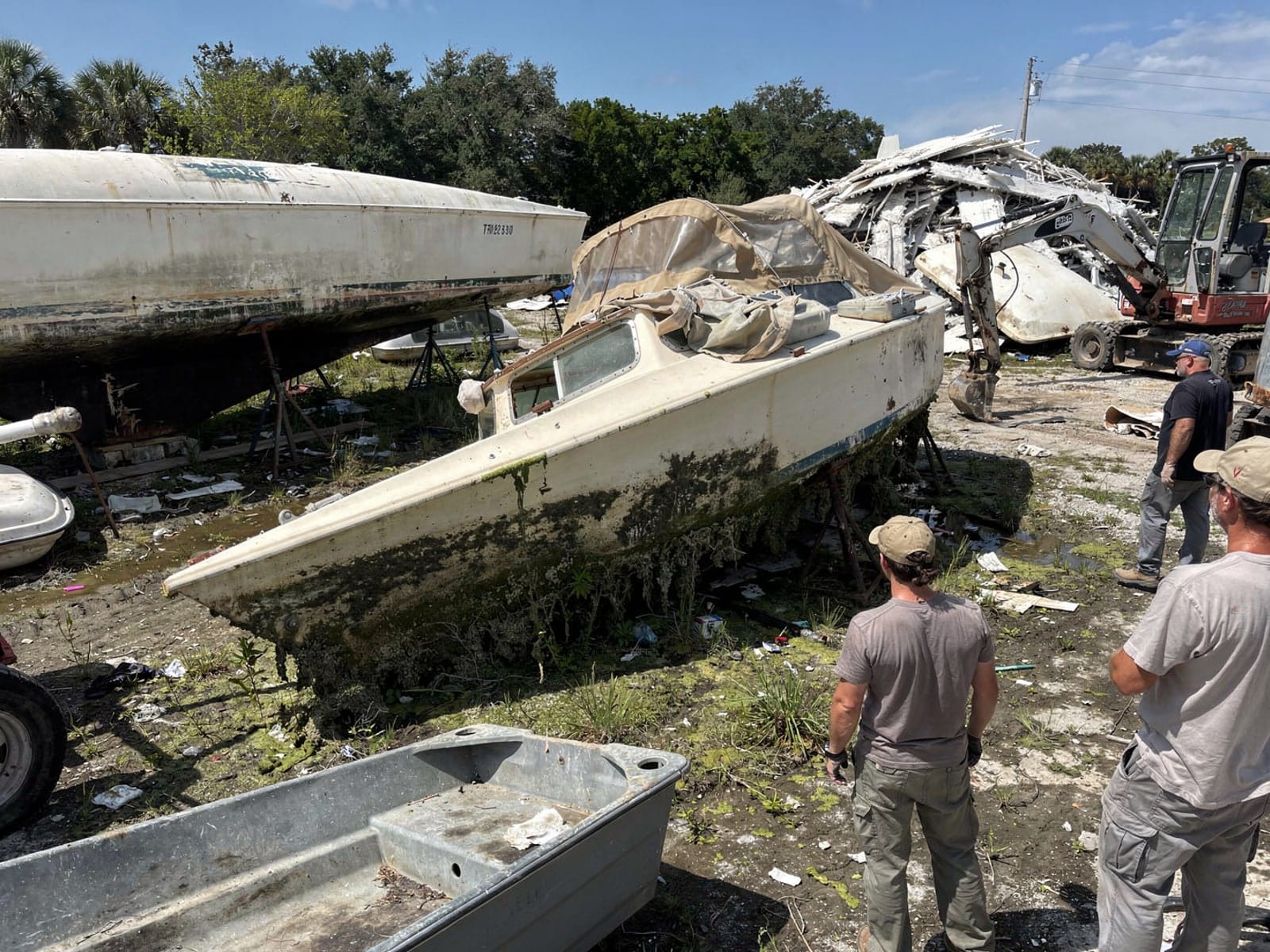 Sunken boat recovery in Ocoee, FL: at the recycling yard 26 ft Pearson 26 from Ocoee, FL at the recycling yard after the recovery