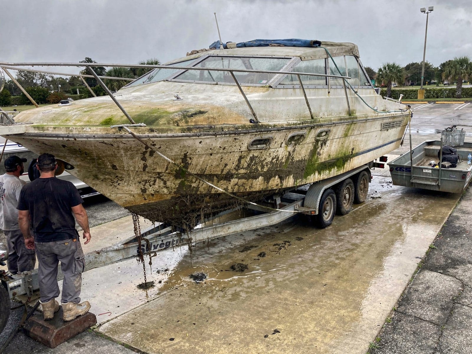 Sunken boat recovery in Palm Valley, FL: pulled out at the ramp 34 ft Silverton 34 pulled out on a trailer at a Palm Valley, FL boat ramp