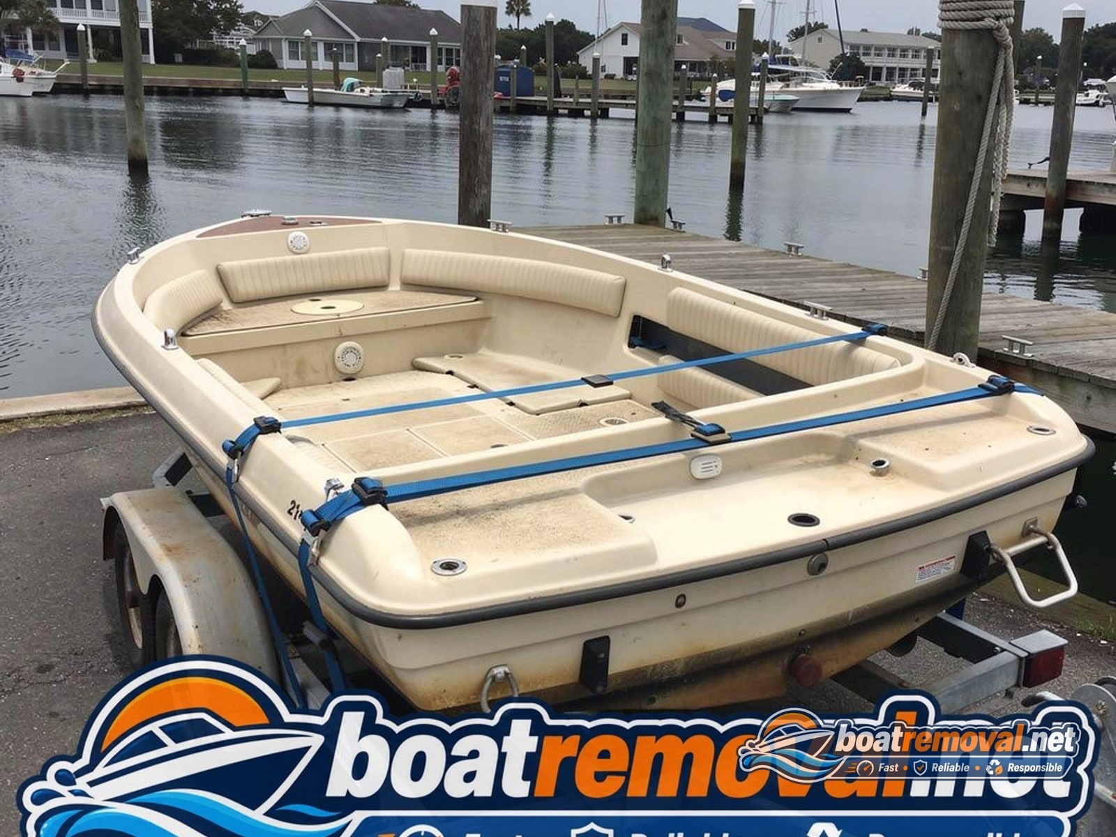 Southport, NC: 21 ft Glastron runabout loaded for removal 21 ft Glastron runabout loaded after storm recovery, Southport North Carolina