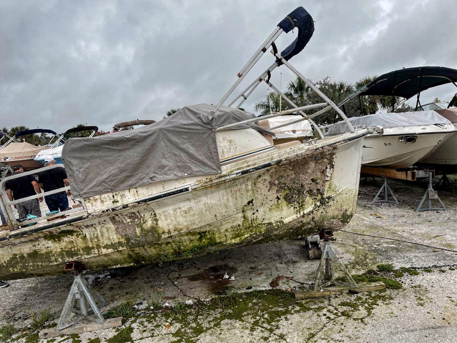 24 ft Harris FloteBote 24 from Callaway, FL on stands at a repair yard after the recovery
