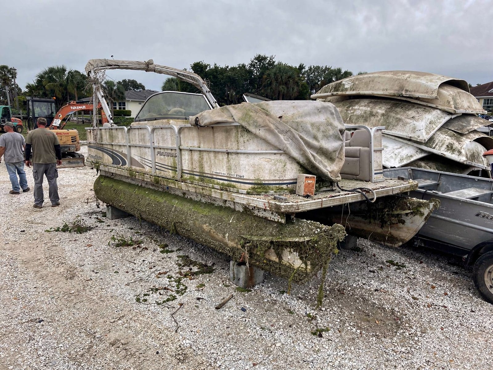 24 ft Harris FloteBote 24 from Clermont, FL at the recycling yard after the recovery