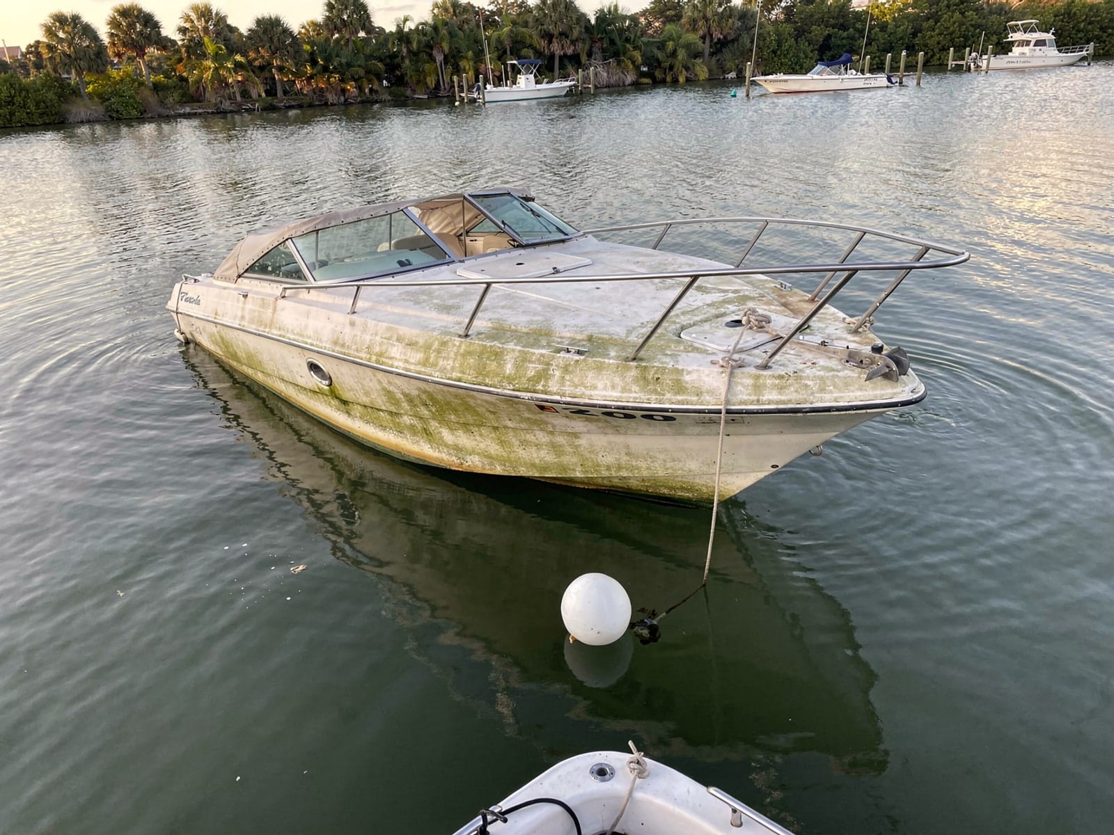 Sunken boat recovery in Davie, FL: before Sunken 24 ft Formula 242 at its mooring in Davie, FL