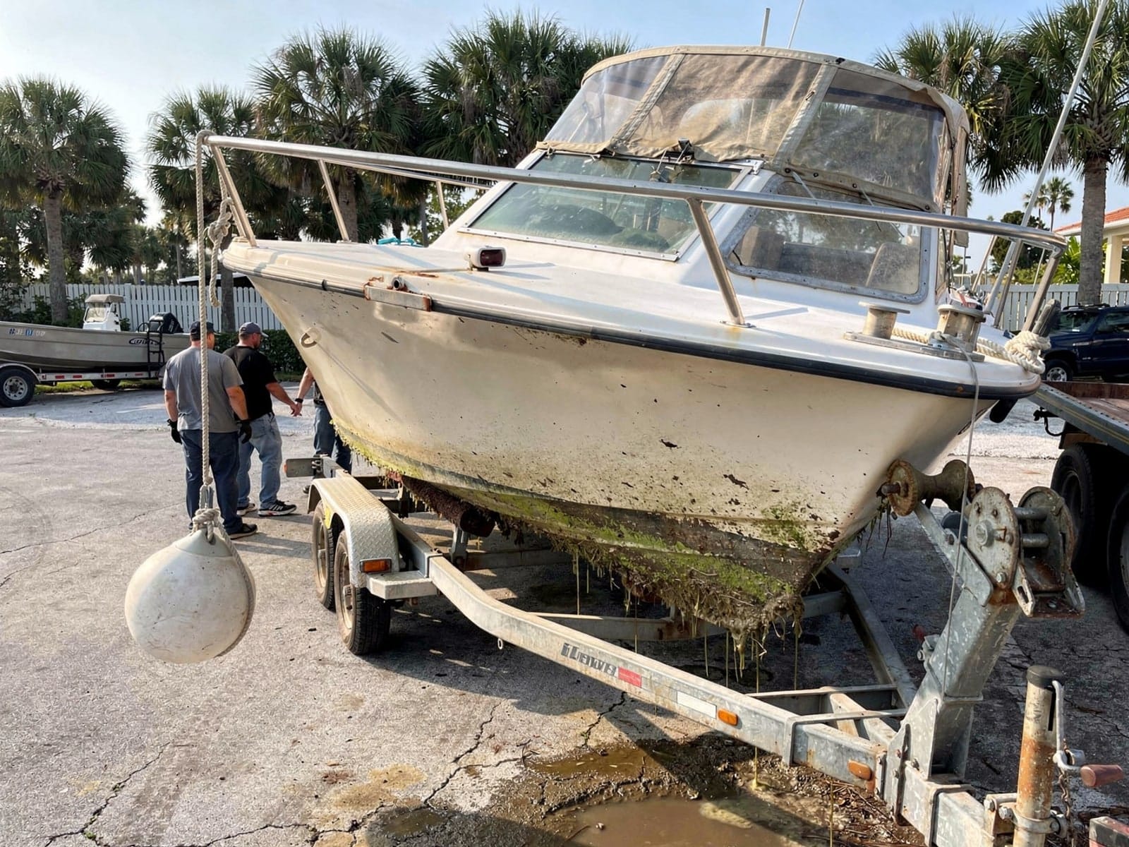 25 ft O'Day 25 pulled out on a trailer at a Asbury Lake, FL boat ramp