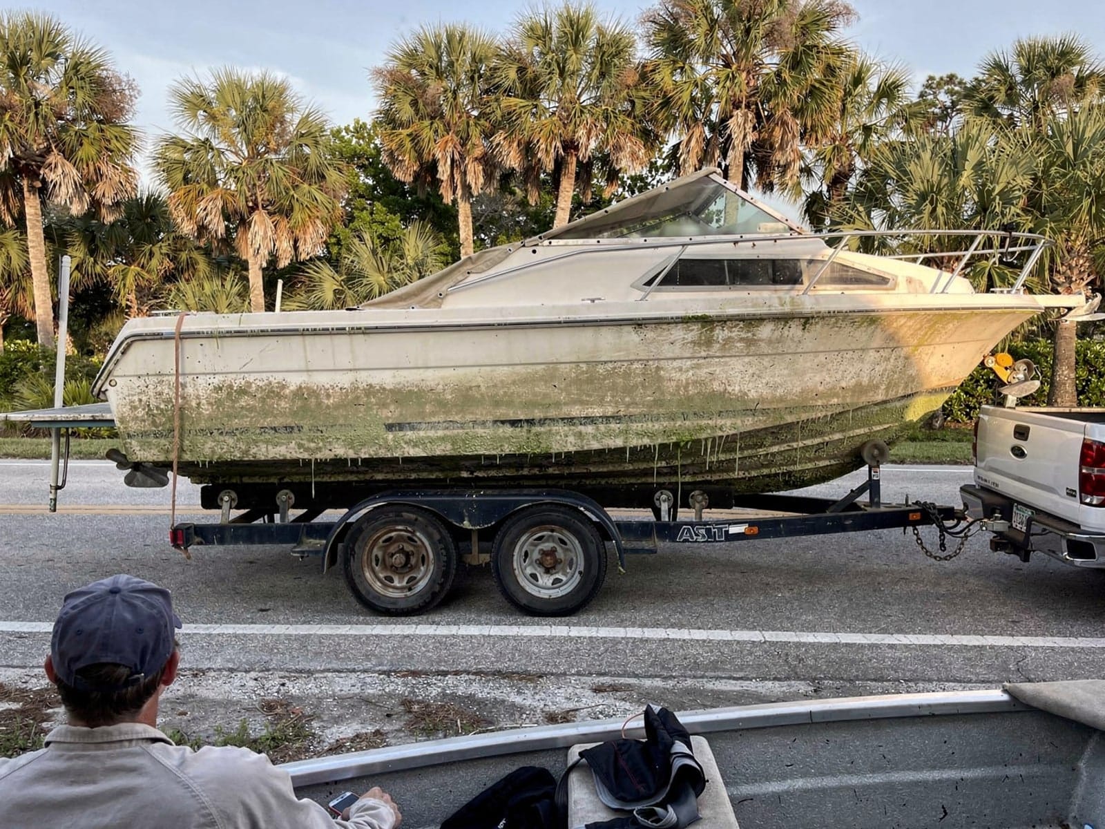 24 ft Bayliner 2455 Ciera hauled out of Cutler Bay, FL on a trailer after the recovery