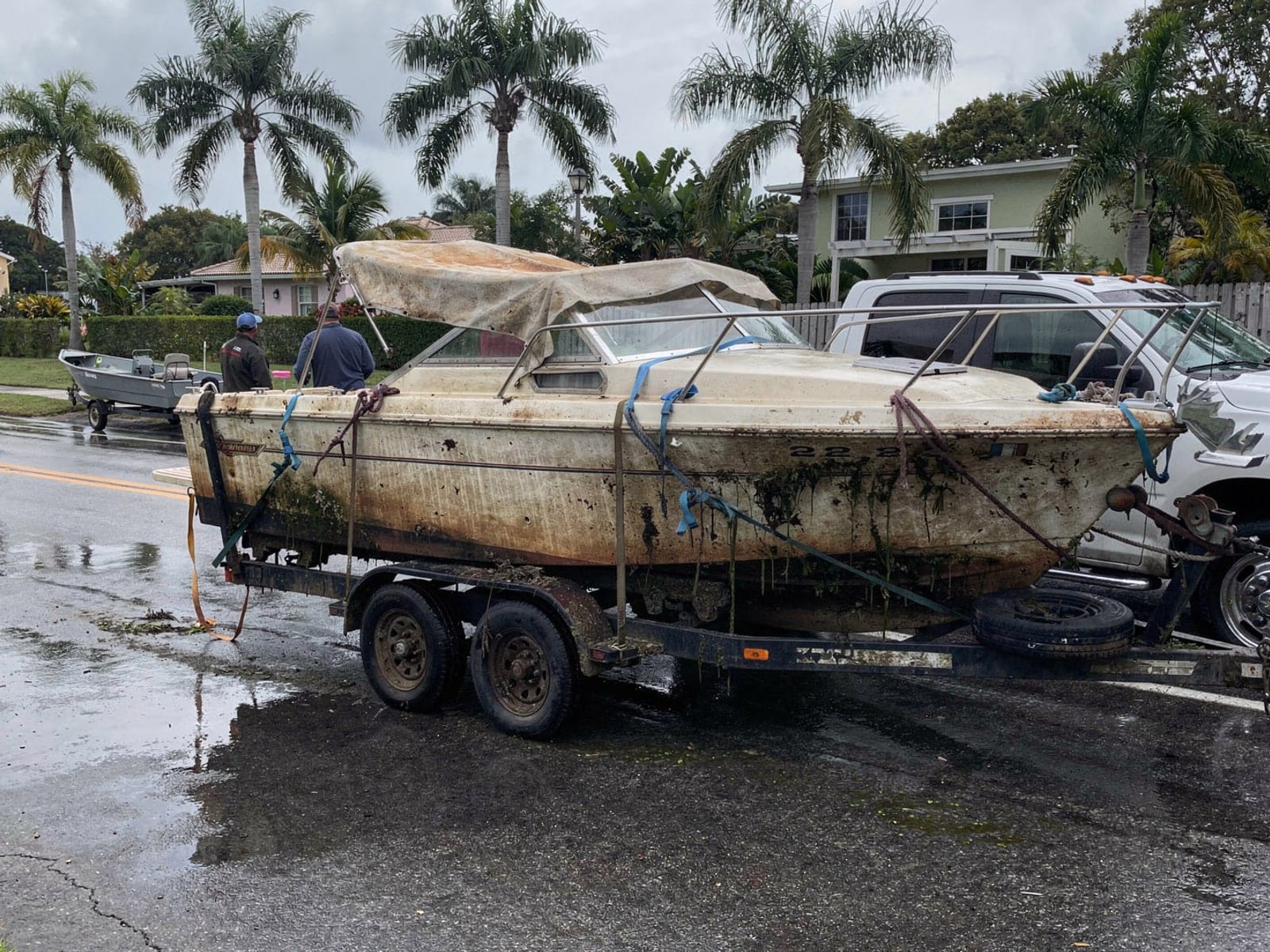 23 ft Chris-Craft Cavalier hauled out of Homestead, FL on a trailer after the recovery
