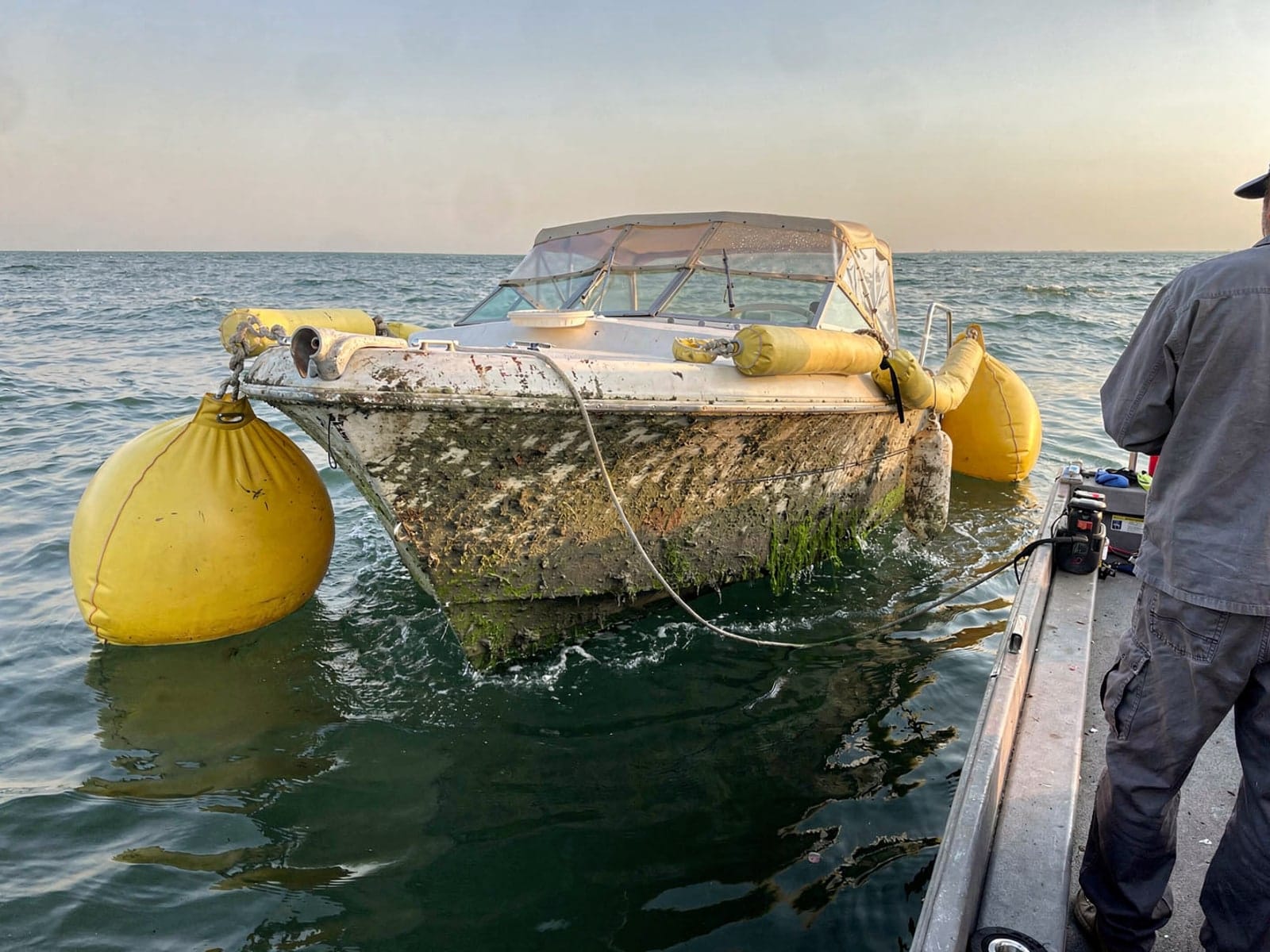 23 ft Chris-Craft Cavalier raised by lift bags in Sebastian, FL