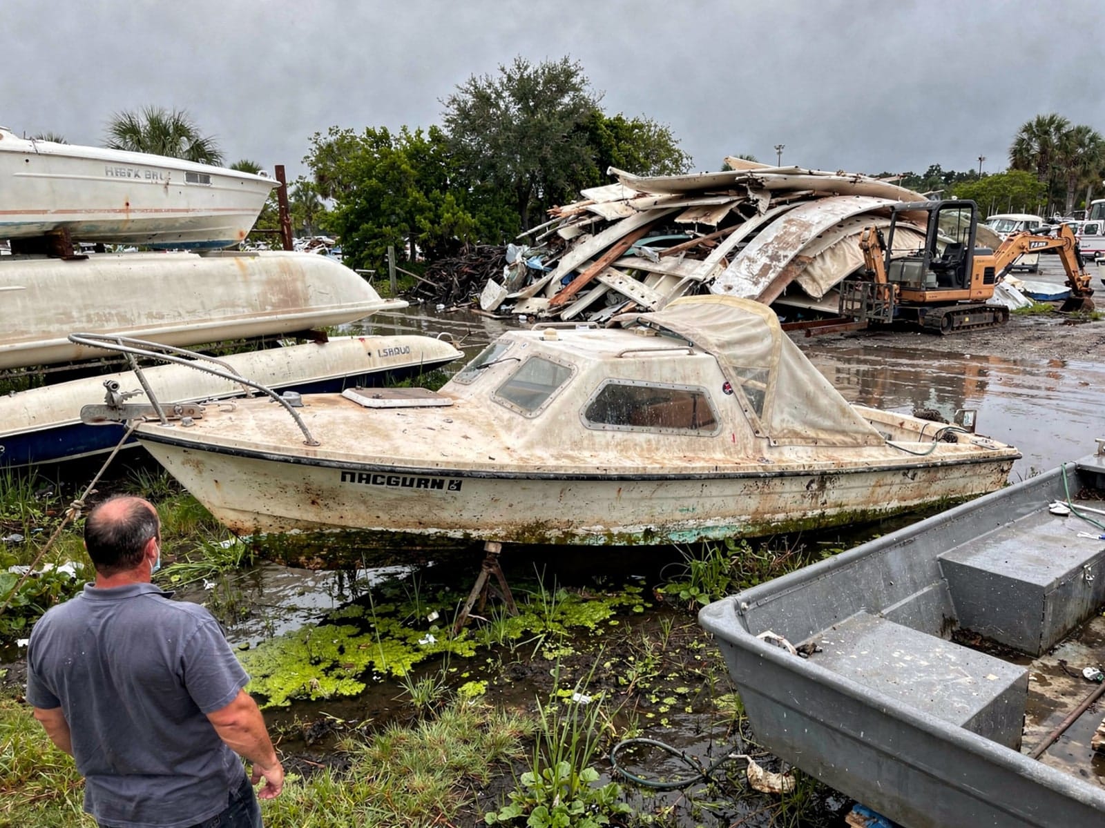 26 ft MacGregor 26 from Country Club, FL at the recycling yard after the recovery