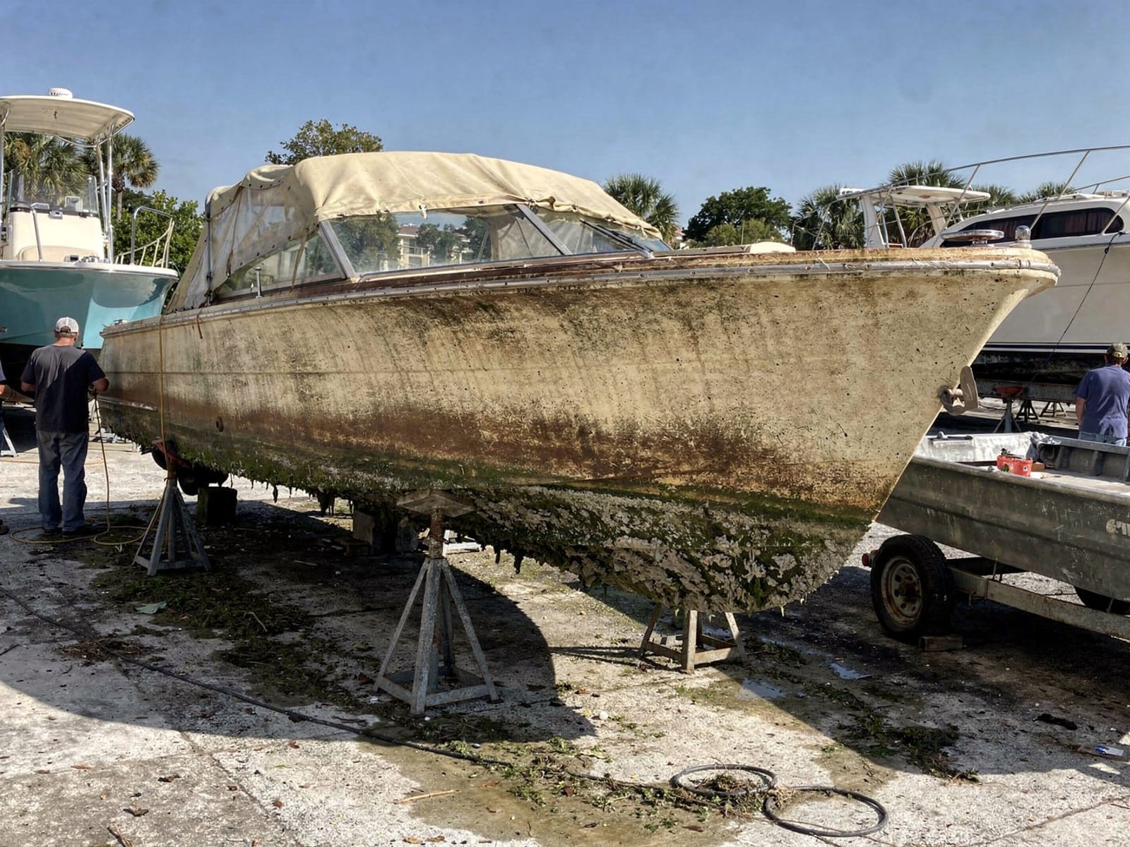 23 ft Chris-Craft Cavalier from Holly Hill, FL on stands at a repair yard after the recovery
