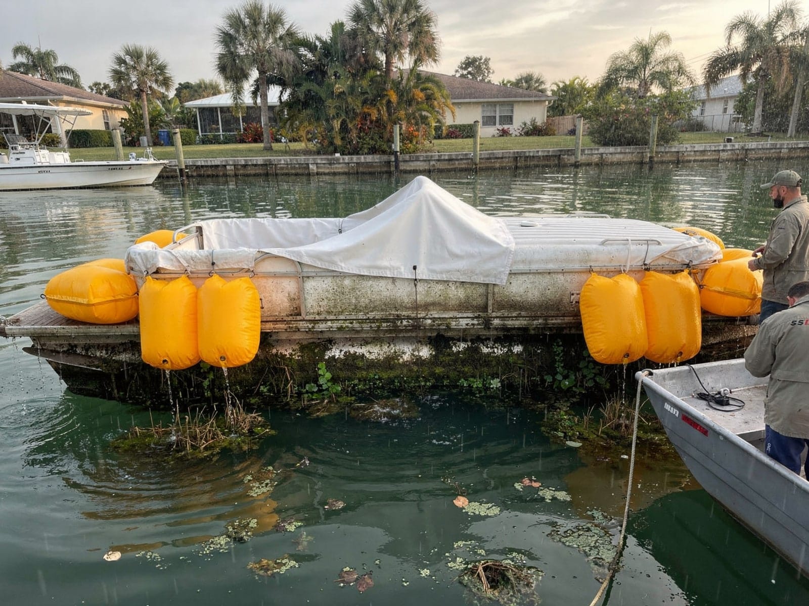 Sunken boat recovery in Port St Lucie, FL: raised with lift bags 20 ft Sylvan Mirage 20 raised by lift bags in Port St Lucie, FL