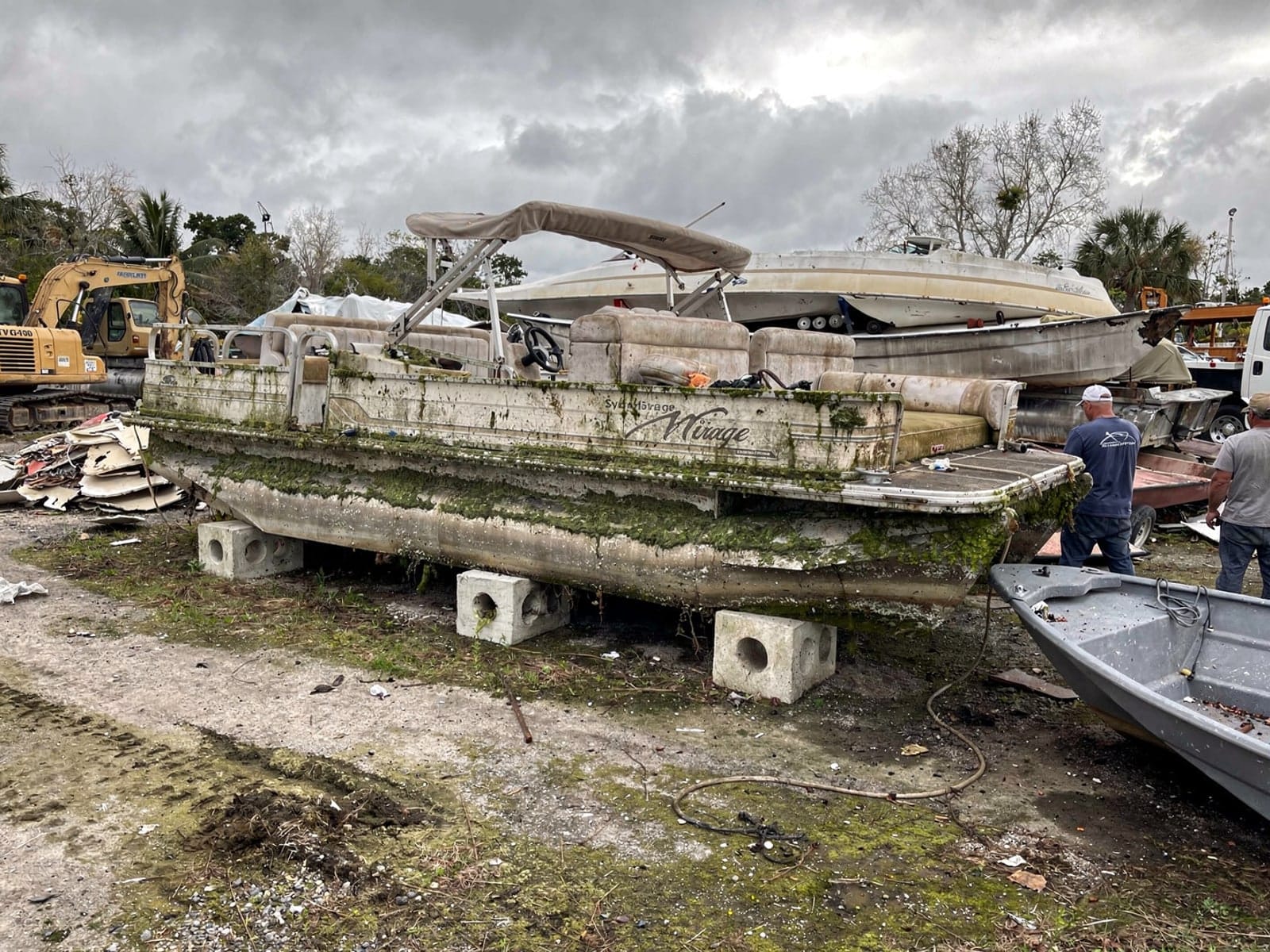 20 ft Sylvan Mirage 20 from Tamarac, FL at the recycling yard after the recovery