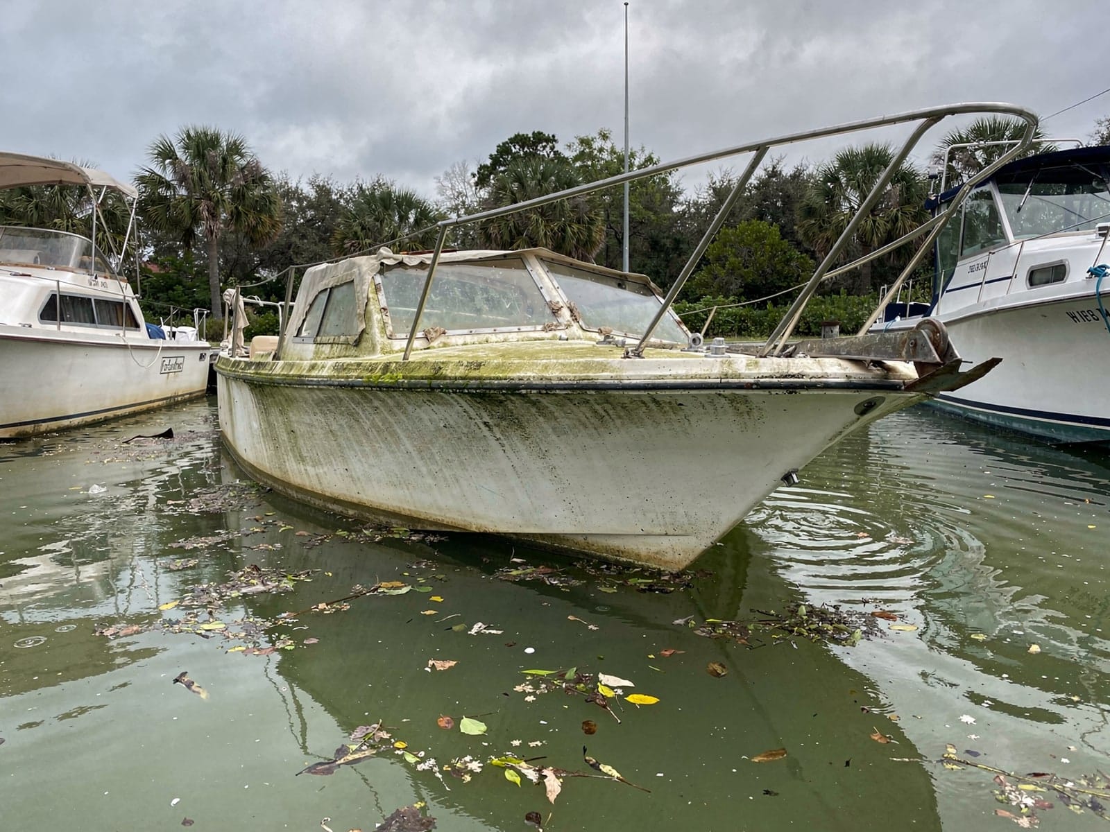 Sunken 26 ft Pearson 26 by a boat ramp in The Crossings, FL