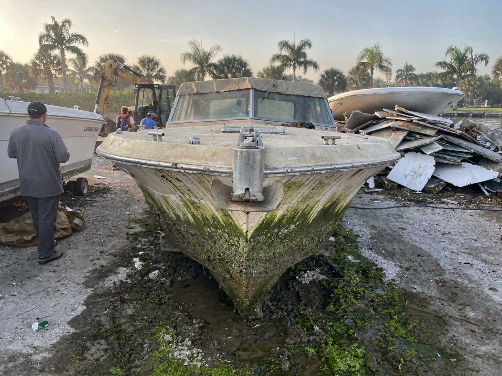 Sunken boat recovery in Titusville, FL: at the recycling yard 23 ft Chris-Craft Cavalier from Titusville, FL at the recycling yard after the recovery