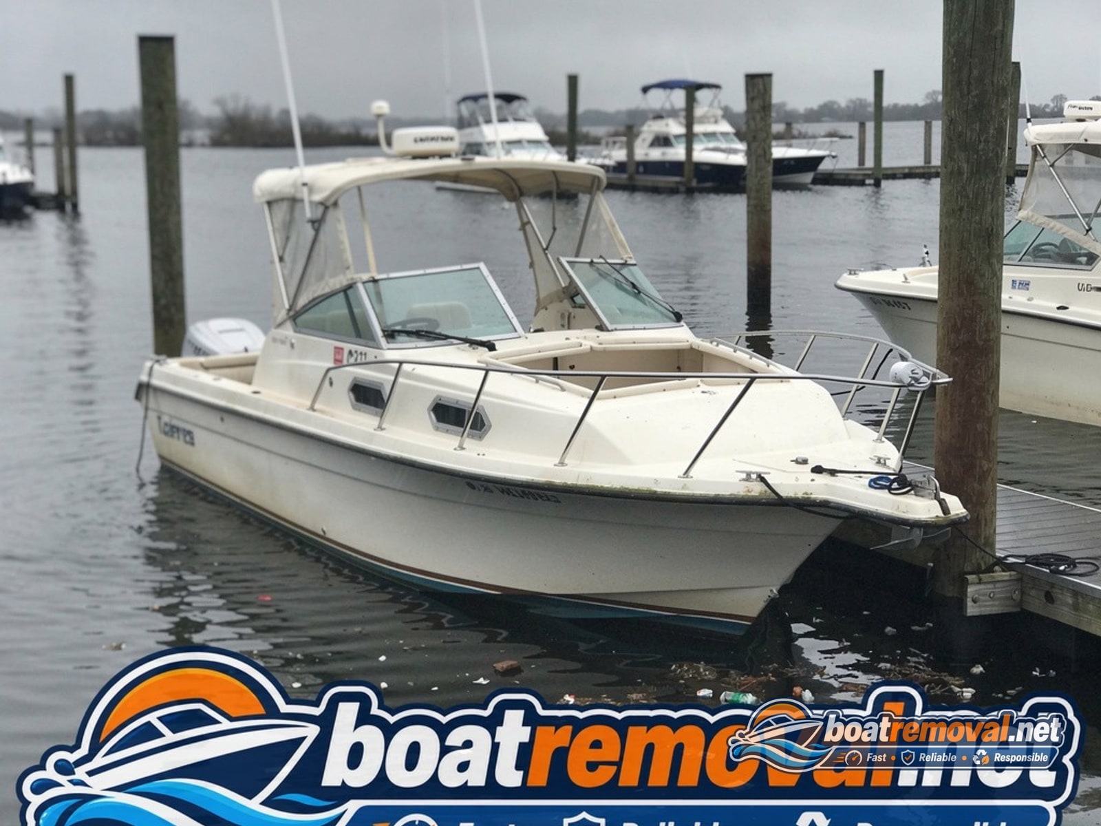 26-foot Donzi cabin cruiser half submerged at a dock in Toms River, New Jersey after a storm surge
