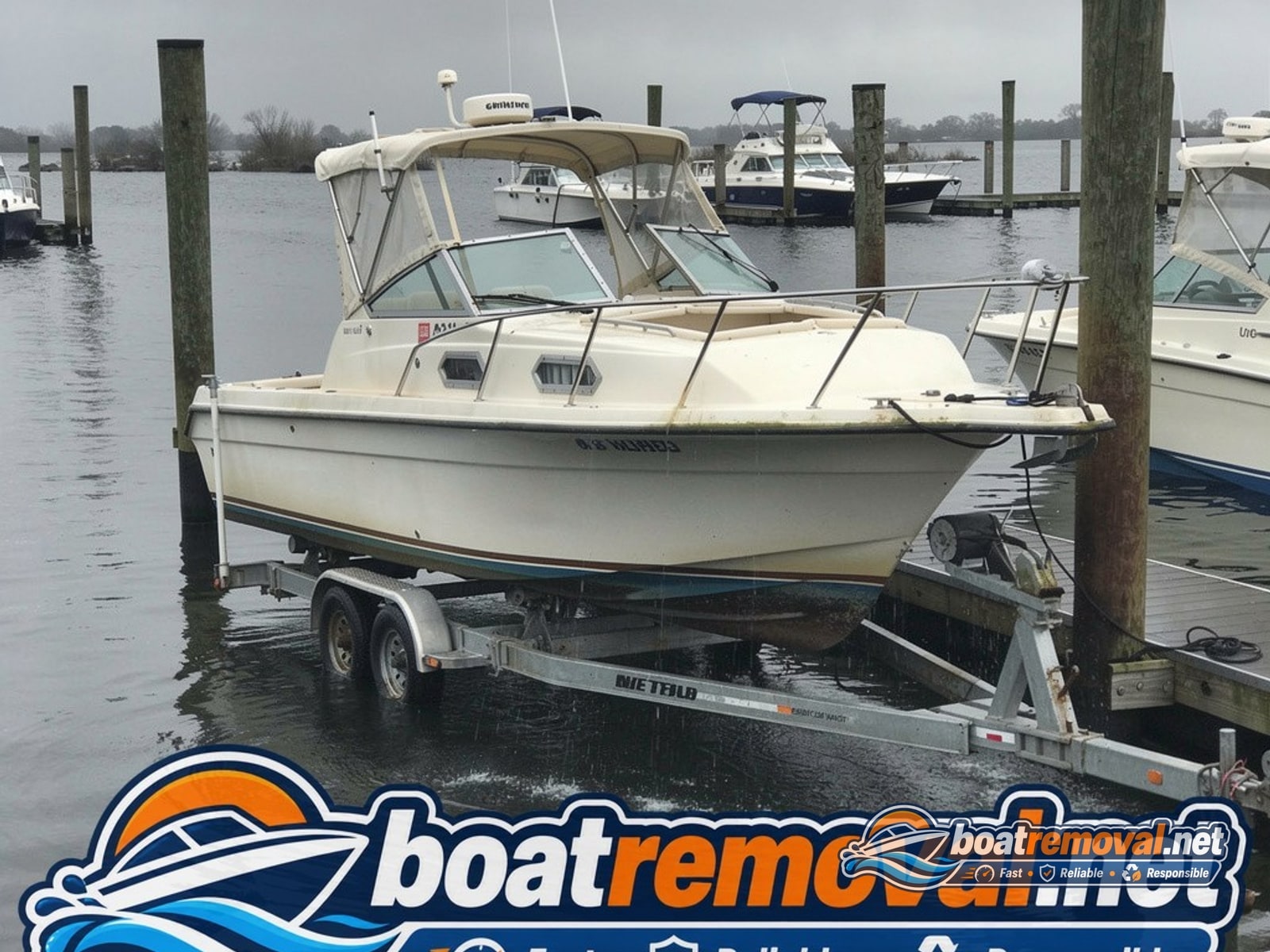 Toms River, NJ: 26-foot Donzi cabin cruiser loaded for removal Same Donzi cabin cruiser raised, drained, and loaded on a trailer after removal