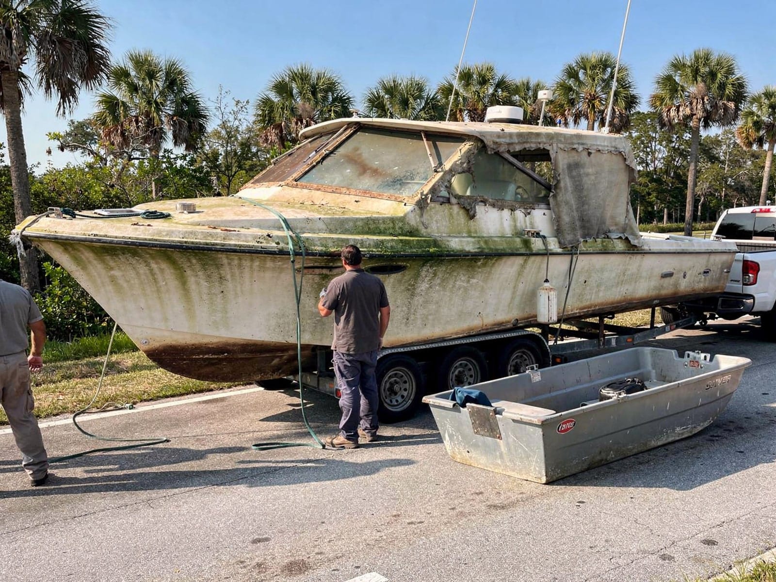 34 ft Silverton 34 hauled out of Bellview, FL on a trailer after the recovery