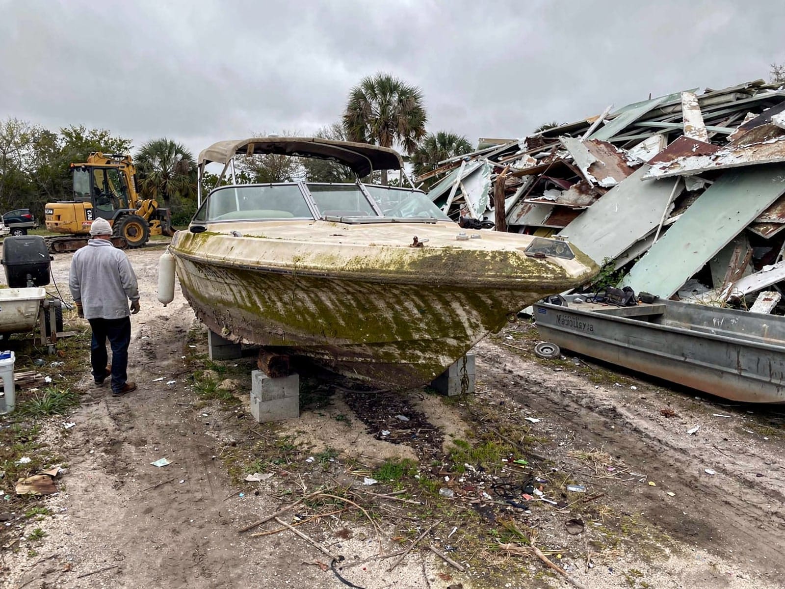Sunken boat recovery in Lake Worth Beach, FL: at the recycling yard 23 ft Rinker 232 from Lake Worth Beach, FL at the recycling yard after the recovery