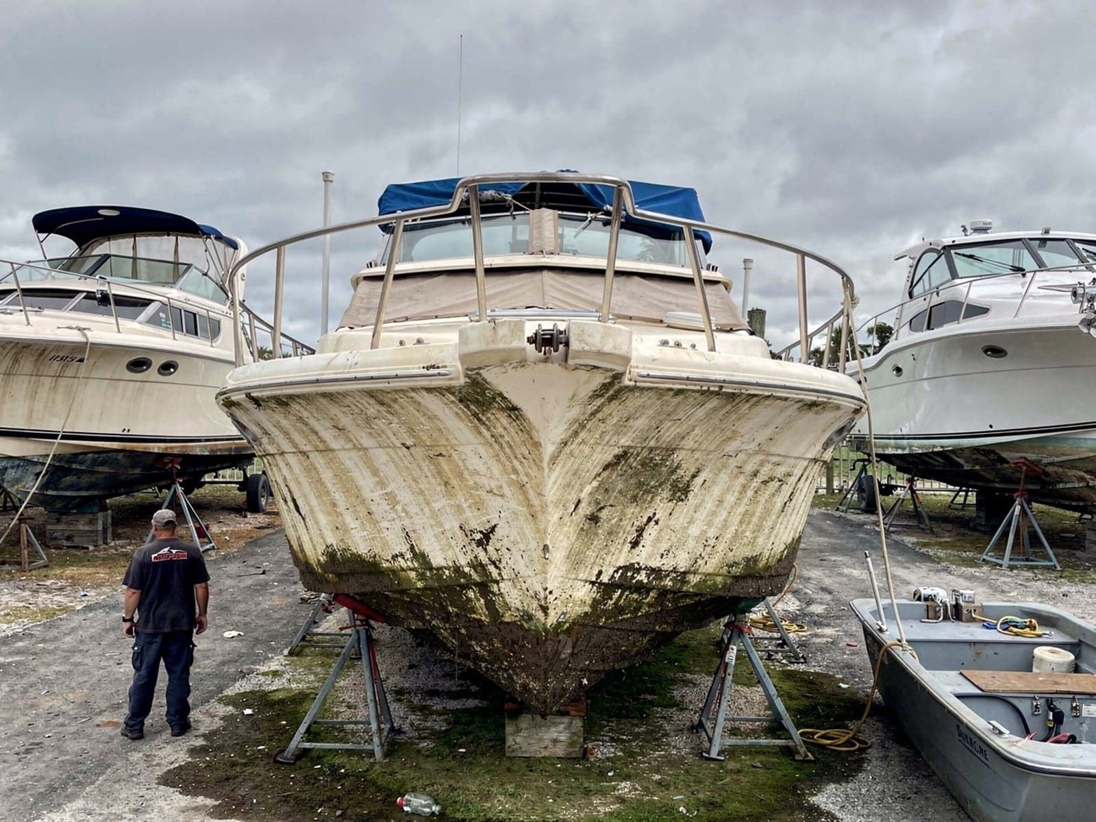 34 ft Silverton 34 from Progress Village, FL on stands at a repair yard after the recovery
