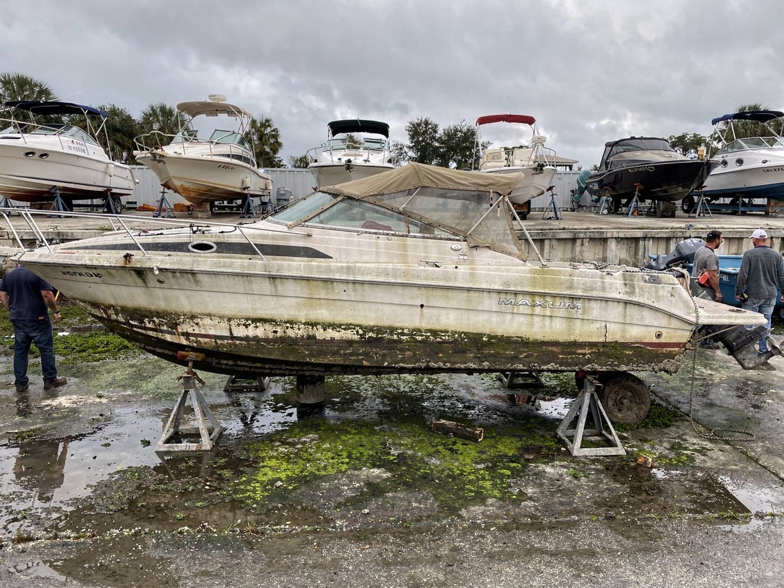 Sunken boat recovery in Thonotosassa, FL: at the repair yard 24 ft Maxum 2400 SCR from Thonotosassa, FL on stands at a repair yard after the recovery