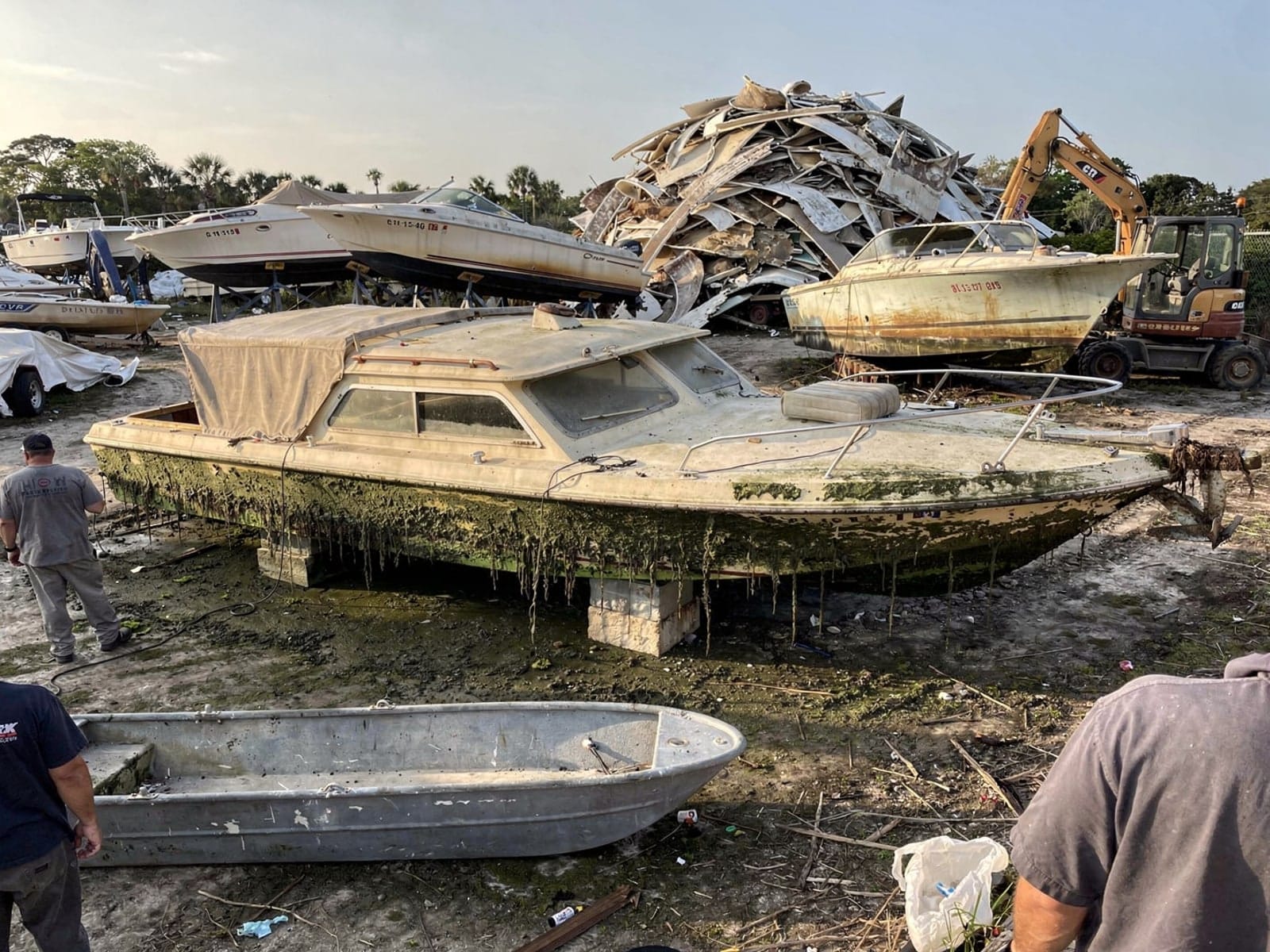 Sunken boat recovery in Wright, FL: at the recycling yard 23 ft Chris-Craft Cavalier from Wright, FL at the recycling yard after the recovery