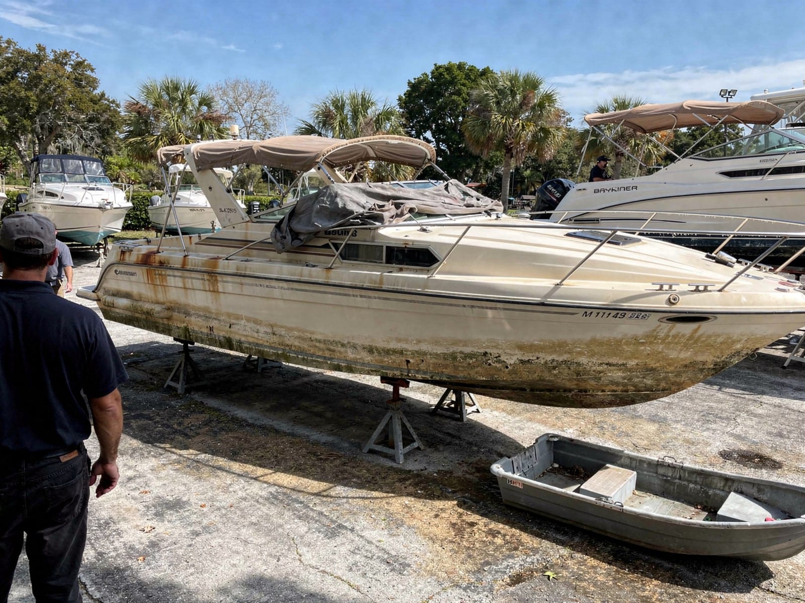 24 ft Bayliner 2455 Ciera from Venice, FL on stands at a repair yard after the recovery