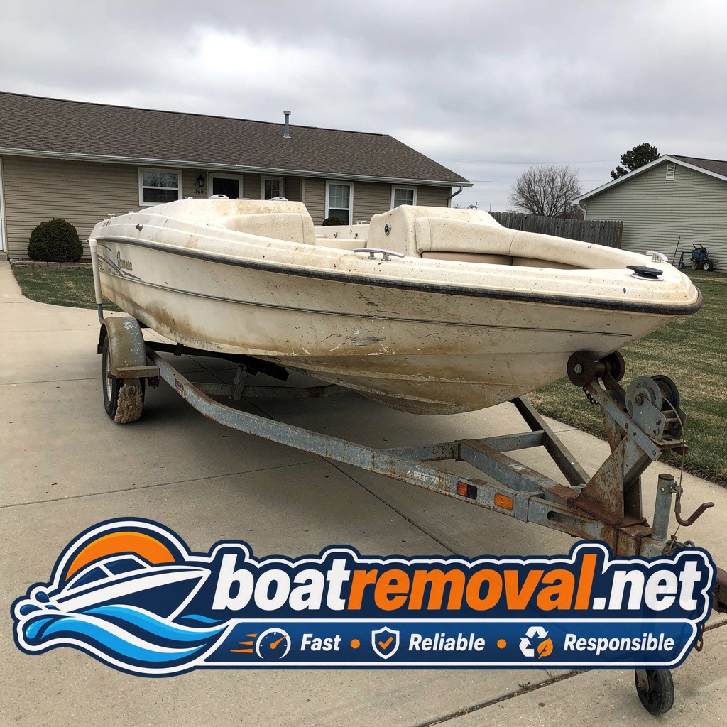 18-foot Four Winns bowrider on flat trailer tires in a Wahoo, Nebraska driveway before pickup