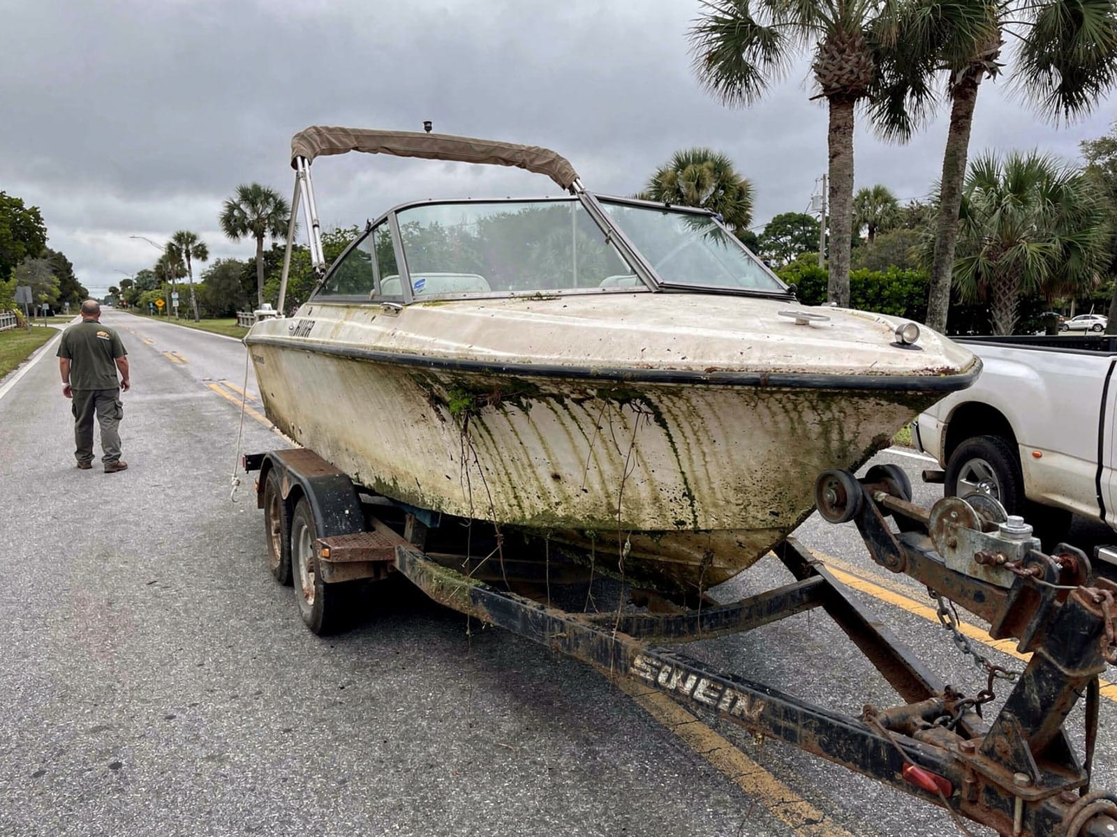 Sunken boat recovery in Wesley Chapel, FL: hauled out on a trailer 23 ft Rinker 232 hauled out of Wesley Chapel, FL on a trailer after the recovery