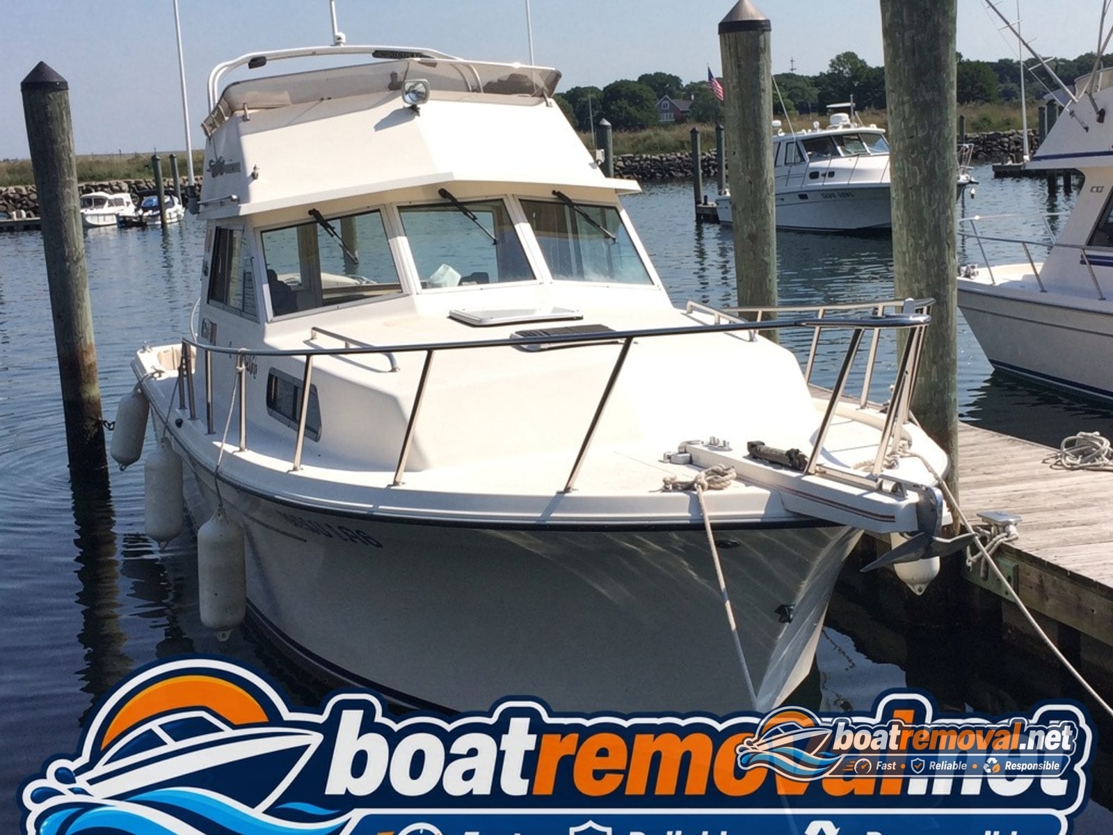 30-foot Chris-Craft cabin cruiser tied up in a marina slip in West Haven, Connecticut