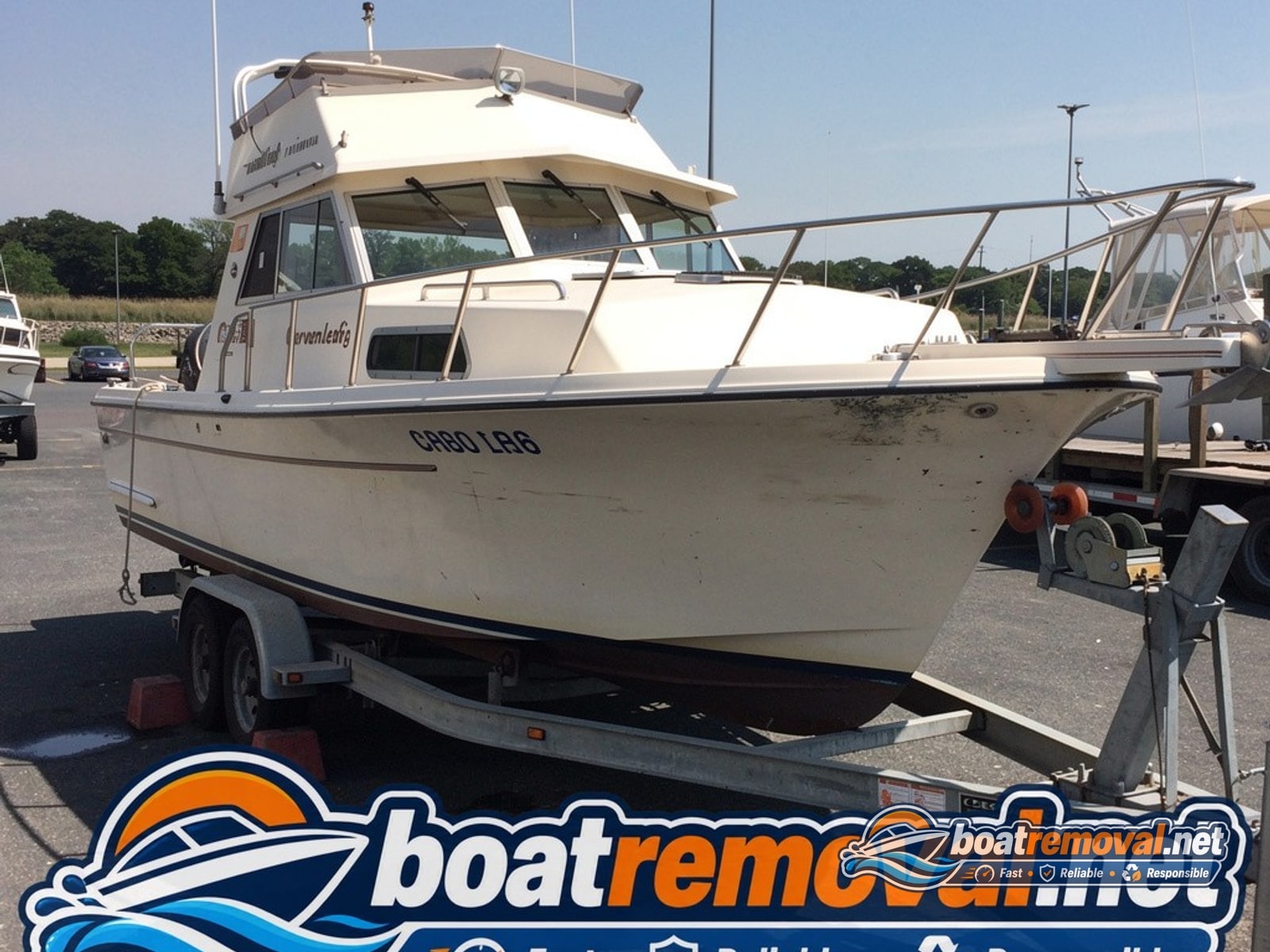 West Haven, CT: 30-foot Chris-Craft cabin cruiser loaded for removal Chris-Craft cabin cruiser loaded onto a trailer after removal from a marina in West Haven, Connecticut