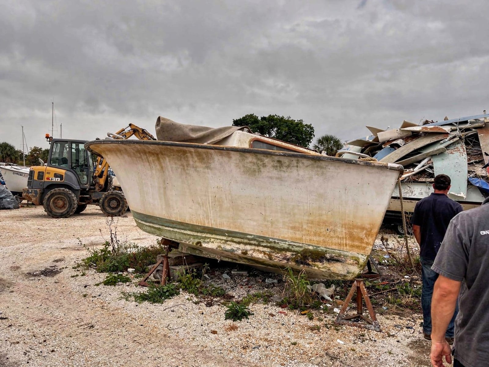 Sunken boat recovery in Westchase, FL: at the recycling yard 26 ft Pearson 26 from Westchase, FL at the recycling yard after the recovery