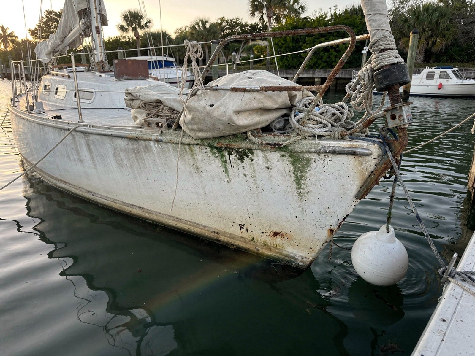 Sunken 27 ft Catalina 27 at its mooring in Winter Garden, FL