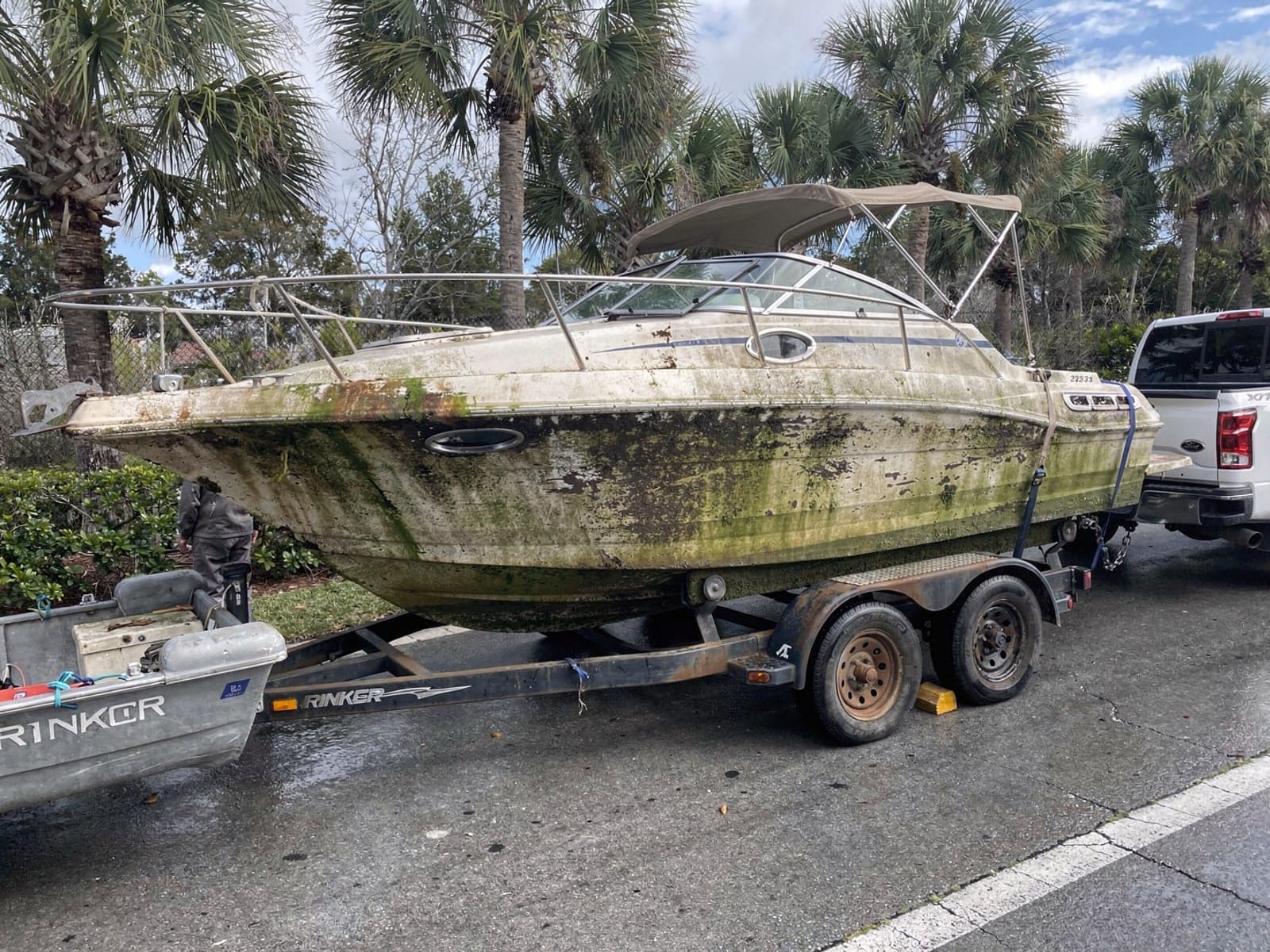 23 ft Rinker 232 hauled out of World Golf Village, FL on a trailer after the recovery